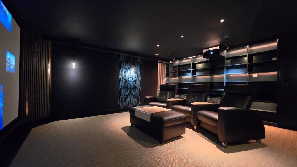 dark blue purple black colour scheme of basement cinema