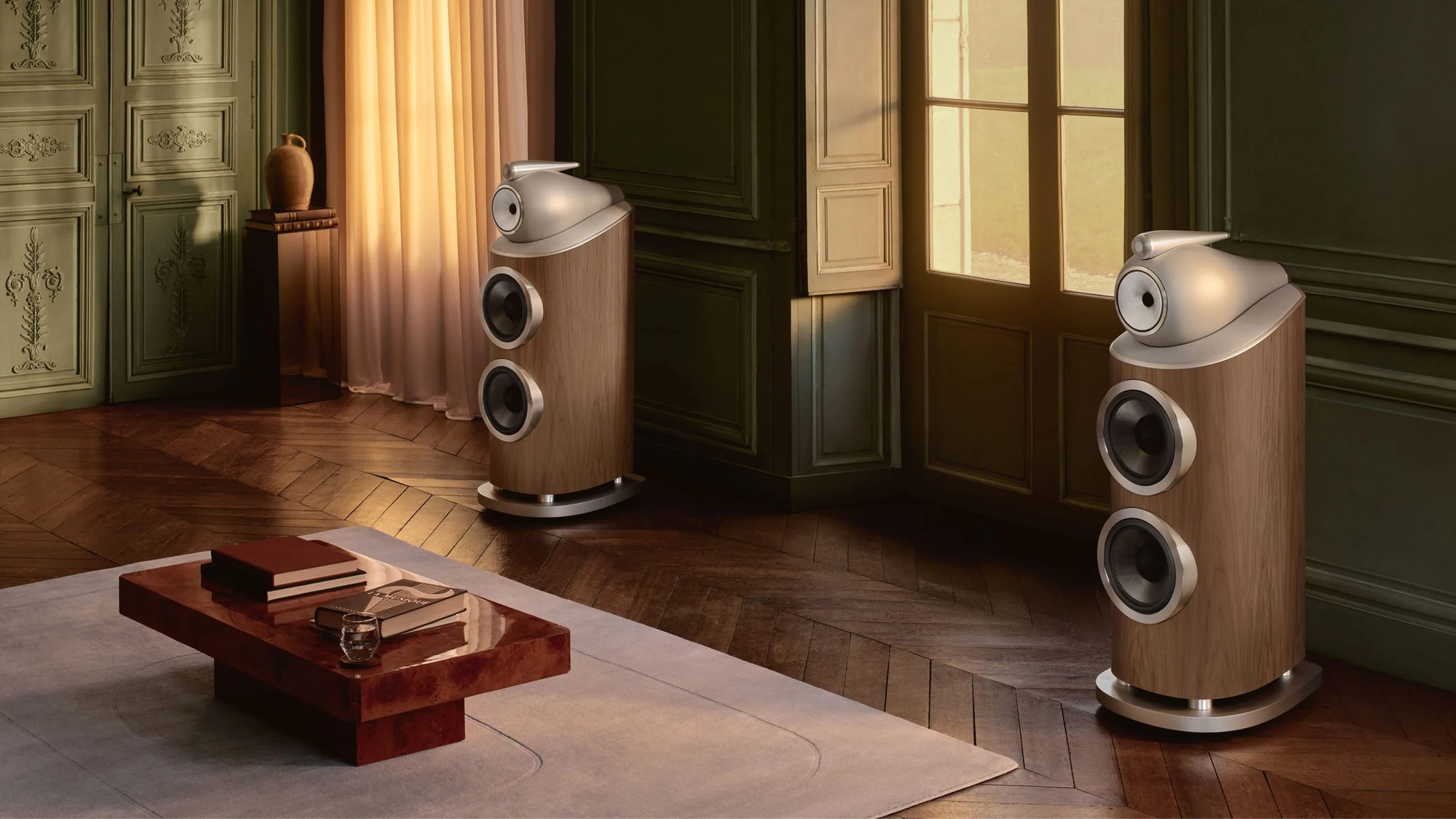 A pair of Bowers & Wilkins 801 D5 speakers in a walnut finish in a panelled room
